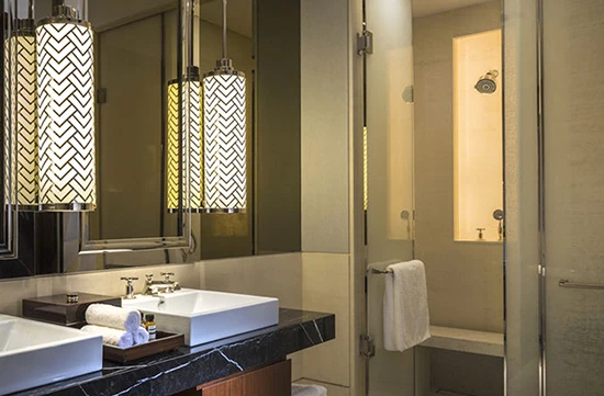 Decorative glass lights and fabric laminated shower enclosure